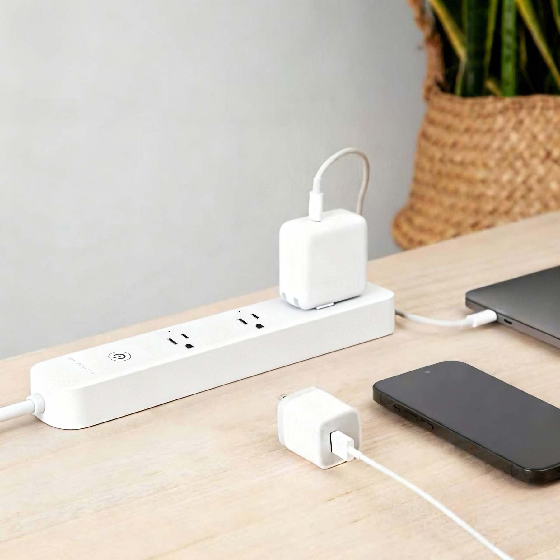 LinkVolt three-outlet smart power strip on a home-office desk